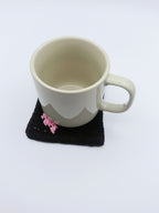 Crochet Wisteria Coaster – Black with Pink Blooms