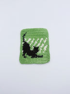Crochet Stretching Cat Coaster – Green with Black Cat Silhouette