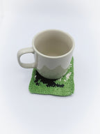Crochet Stretching Cat Coaster – Green with Black Cat Silhouette