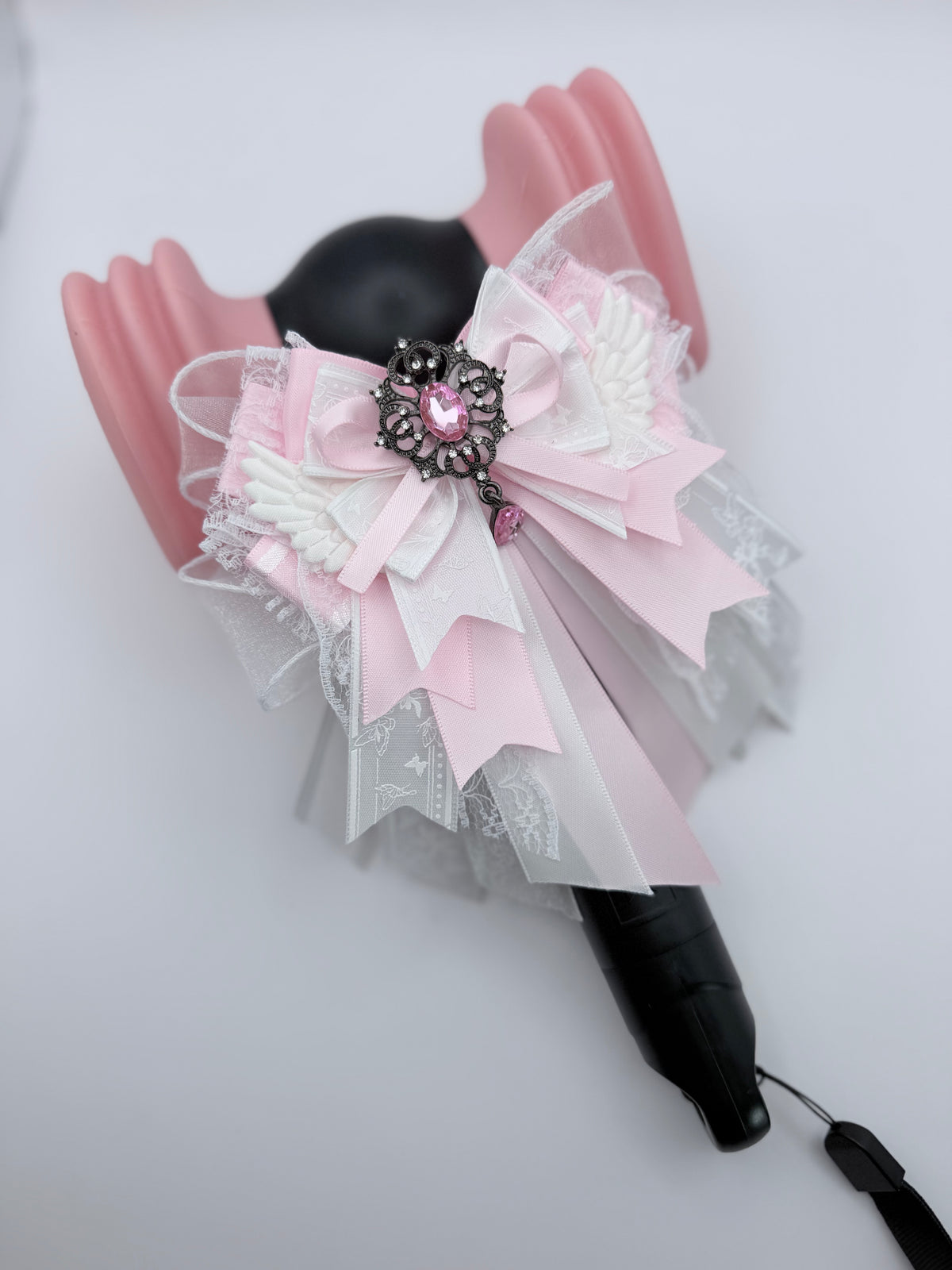 K-Pop lightstick bow decoration in pink and white with gothic brooch